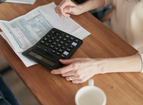 Woman filling up tax forms