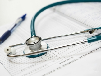Stethoscope over list of patient names