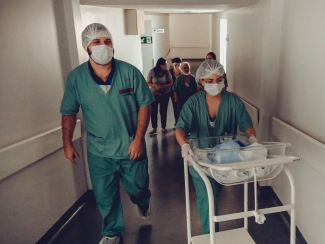 Nurses walking through hospital hallway